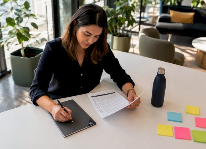 Cybersecurity compliance basics: 2026 guide for IT teams - Re-solution IT officer reviewing compliance checklist at desk