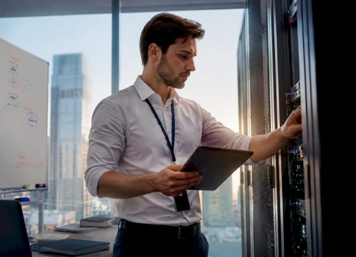 Why IT infrastructure matters for business in 2026 - Re-solution Network engineer inspecting servers in data center